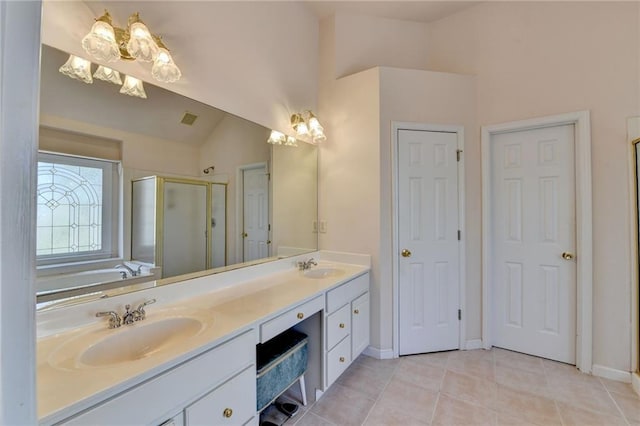 full bathroom with tile patterned flooring, visible vents, a shower stall, double vanity, and a sink