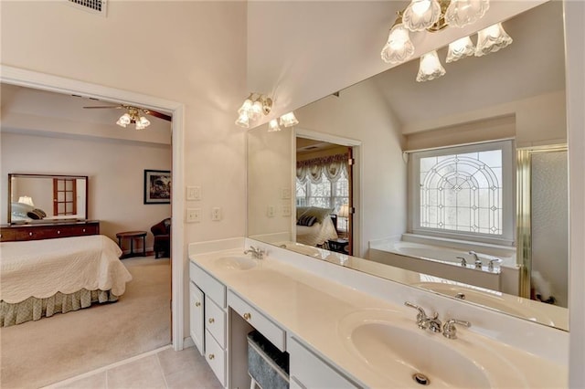 ensuite bathroom featuring double vanity, ensuite bath, an inviting chandelier, and a sink