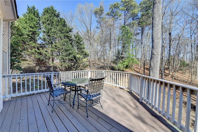 deck with outdoor dining space