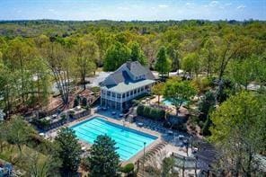 birds eye view of property with a wooded view