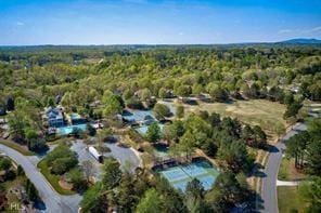 birds eye view of property with a forest view