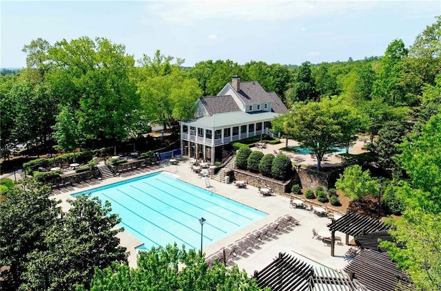 pool featuring a patio and fence