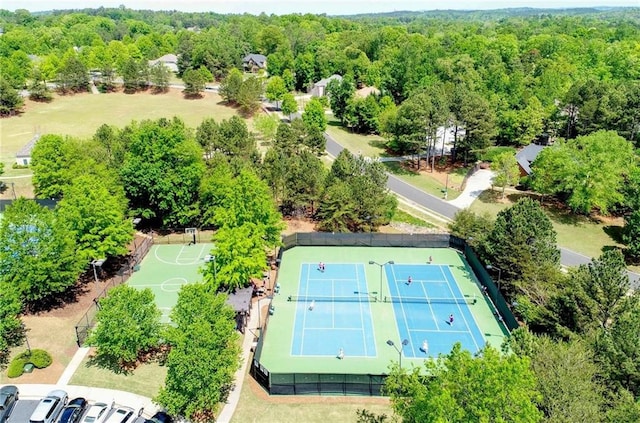 bird's eye view featuring a wooded view