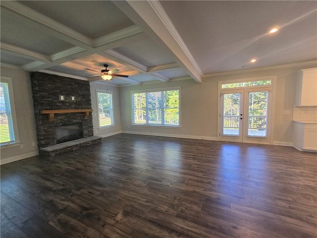 unfurnished living room featuring a fireplace, beam ceiling, dark wood-type flooring, and coffered ceiling