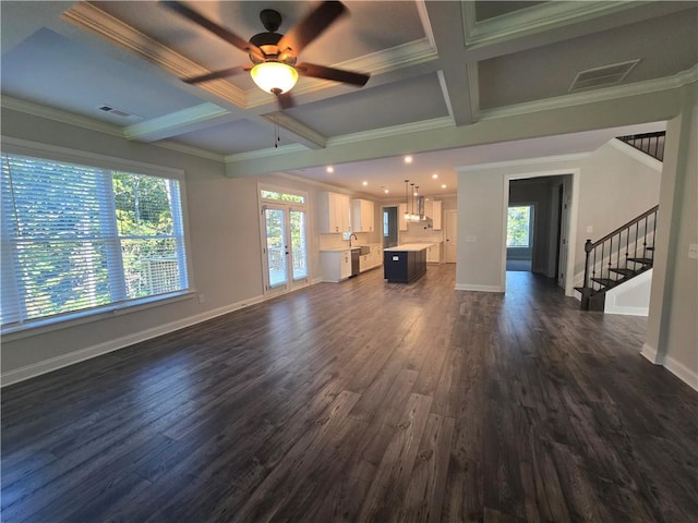 unfurnished living room featuring french doors, coffered ceiling, ceiling fan, dark wood-type flooring, and beamed ceiling