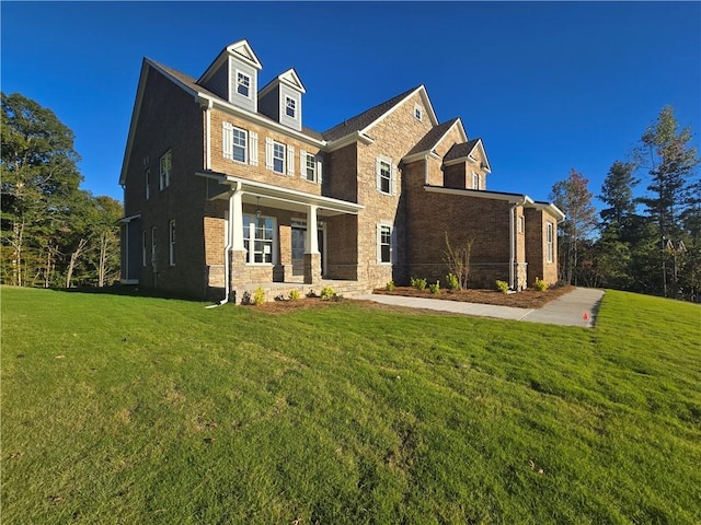 view of front of property featuring a porch and a front lawn