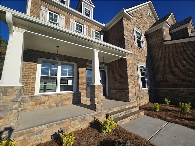 doorway to property with a porch