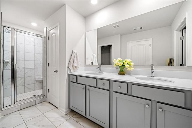 309 Vista Ln, Woodstock, GA 30189 - full bath with a shower stall, visible vents, marble finish floor, and a sink