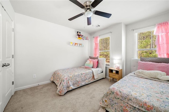 309 Vista Ln, Woodstock, GA 30189 - carpeted bedroom with visible vents, baseboards, and a ceiling fan
