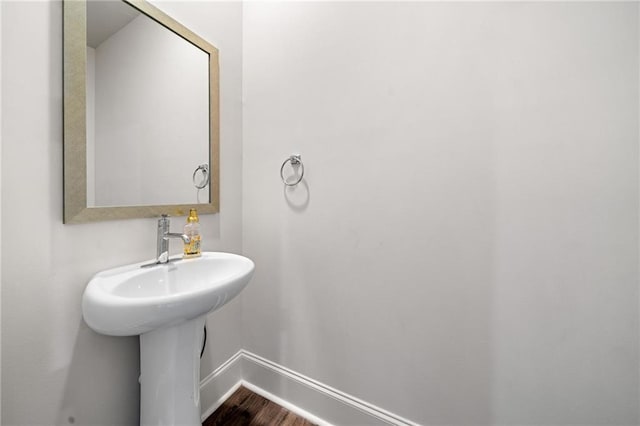 309 Vista Ln, Woodstock, GA 30189 - bathroom with baseboards and wood finished floors
