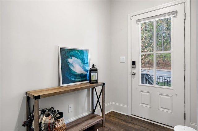 309 Vista Ln, Woodstock, GA 30189 - doorway to outside featuring baseboards and dark wood-style floors