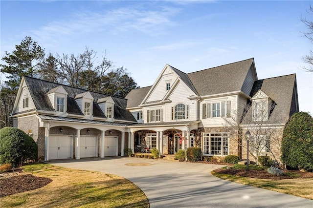 view of front of house featuring a porch and a garage