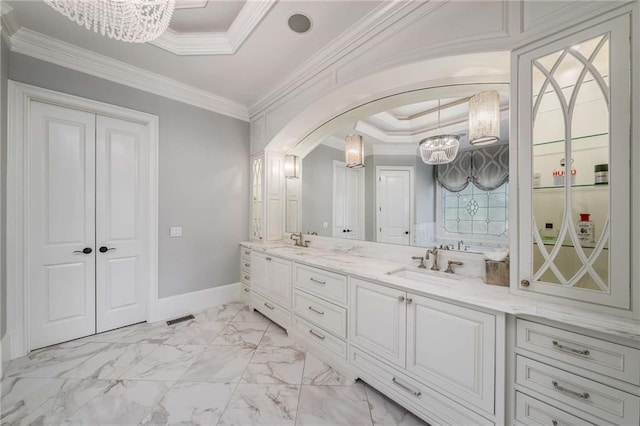 bathroom featuring vanity, crown molding, a tray ceiling, and an inviting chandelier