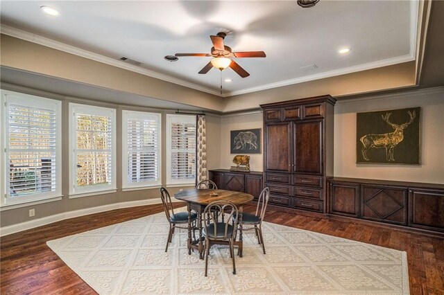 dining area with crown molding, ceiling fan, a healthy amount of sunlight, and wood-type flooring