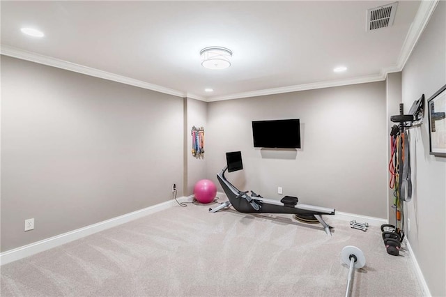 workout area with carpet flooring and ornamental molding