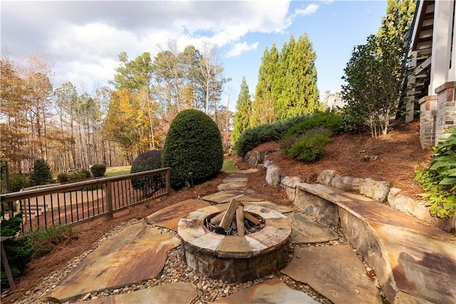 view of patio with an outdoor fire pit