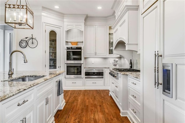 kitchen featuring white cabinets, sink, and stainless steel appliances