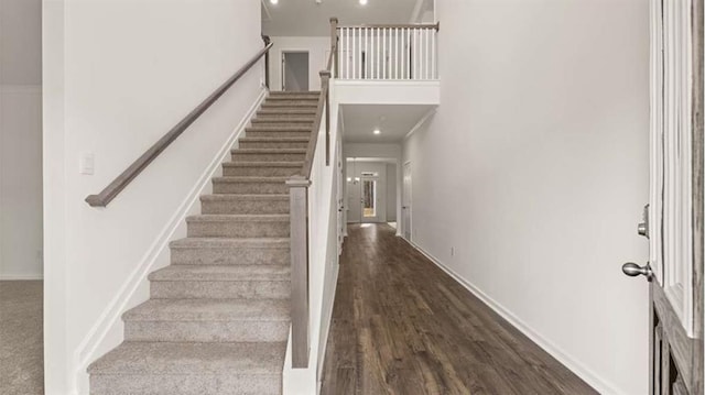 13567 Whitman Ln, Covington, GA 30014 - staircase featuring wood finished floors and baseboards