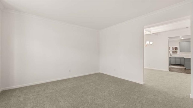 13567 Whitman Ln, Covington, GA 30014 - empty room featuring carpet floors, crown molding, and baseboards