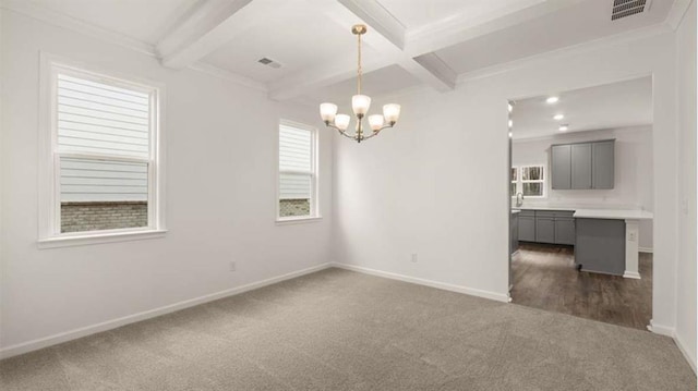 13567 Whitman Ln, Covington, GA 30014 - empty room featuring dark carpet, a chandelier, baseboards, beam ceiling, and coffered ceiling