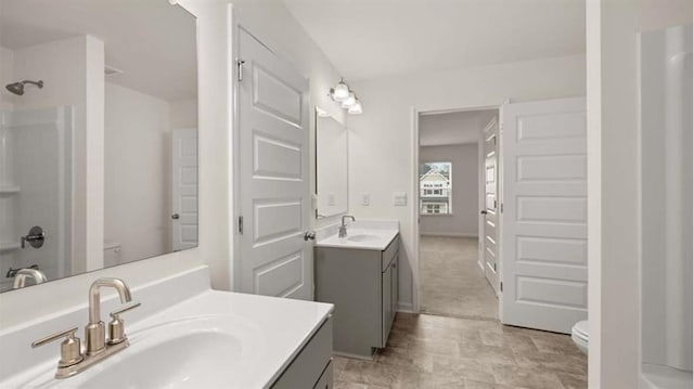 13567 Whitman Ln, Covington, GA 30014 - bathroom featuring toilet and two vanities