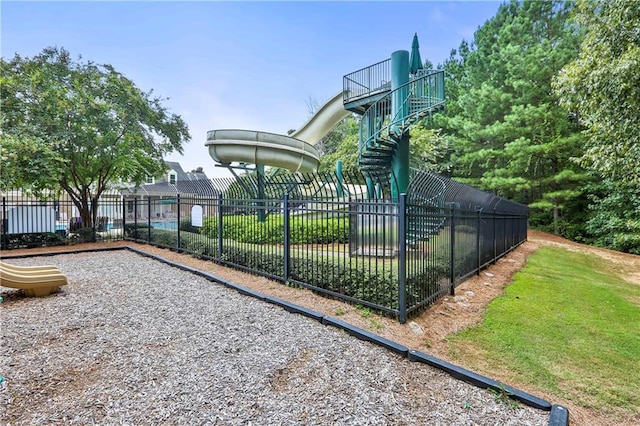 view of basketball court with fence and playground community