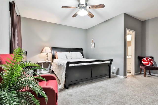 bedroom with carpet, connected bathroom, baseboards, and ceiling fan