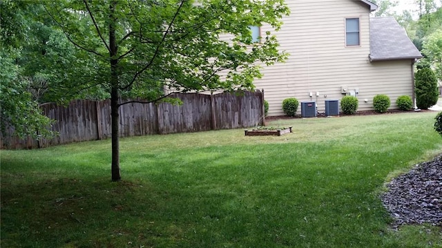 view of yard with central AC unit