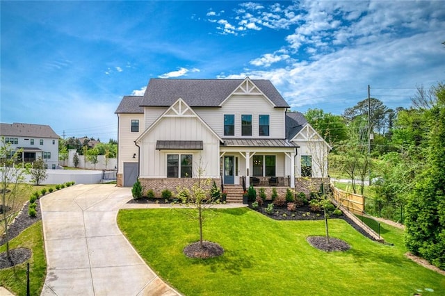 craftsman house with a front yard and a porch