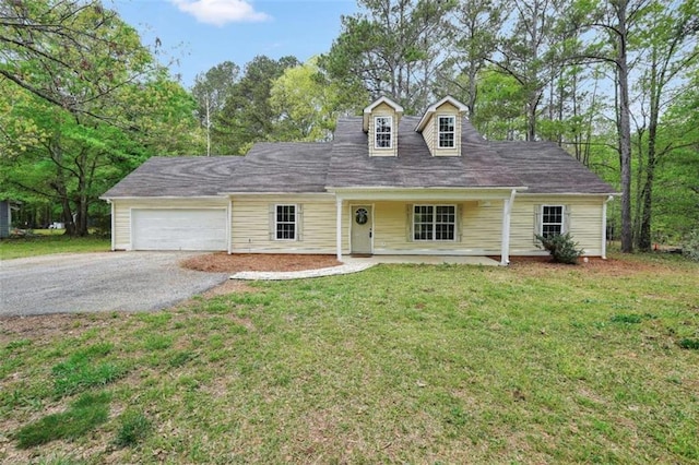 254 Barnesville Rd, Milner, GA 30257 - cape cod-style house with a garage, driveway, and a front lawn