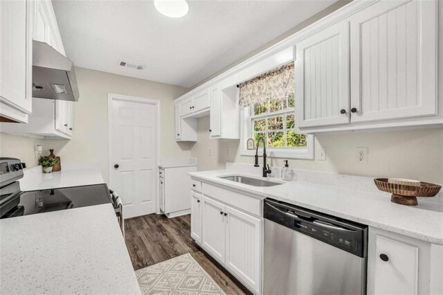 254 Barnesville Rd, Milner, GA 30257 - kitchen featuring stainless steel appliances, a sink, visible vents, wall chimney range hood, and dark wood-type flooring