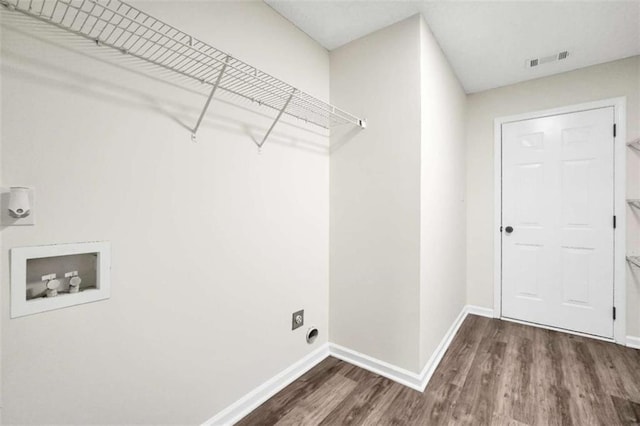 254 Barnesville Rd, Milner, GA 30257 - clothes washing area featuring hookup for a washing machine, wood finished floors, electric dryer hookup, laundry area, and visible vents