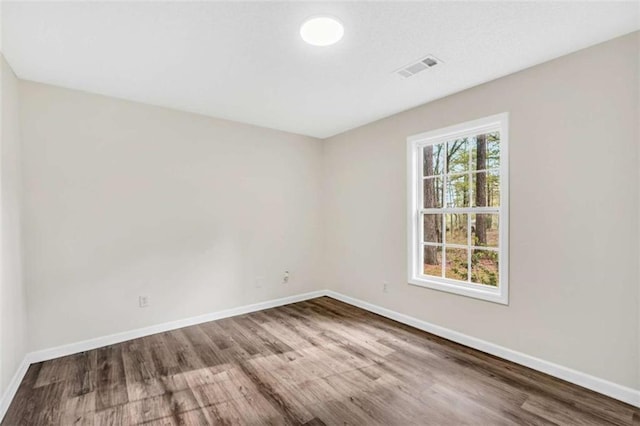 254 Barnesville Rd, Milner, GA 30257 - unfurnished room with visible vents, baseboards, and wood finished floors