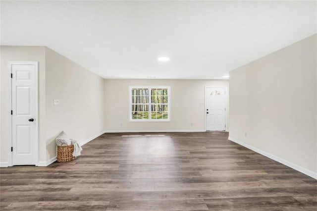 254 Barnesville Rd, Milner, GA 30257 - unfurnished living room with baseboards, wood finished floors, and recessed lighting