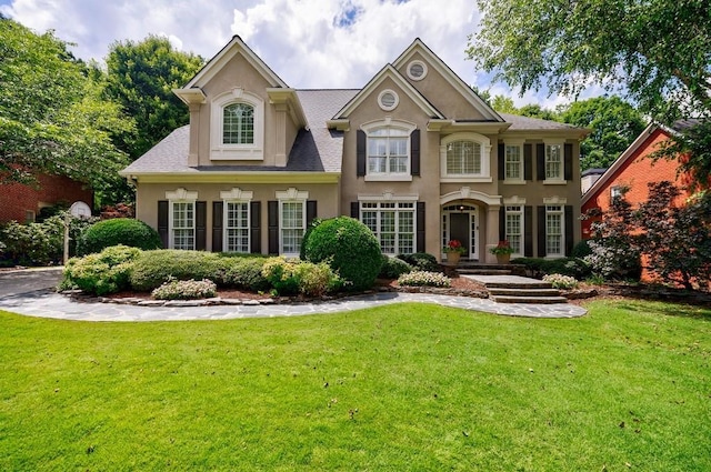 4310 Granby Way, Marietta, GA 30062 - view of front facade featuring stucco siding and a front yard
