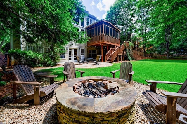 4310 Granby Way, Marietta, GA 30062 - back of property featuring an outdoor fire pit, a patio area, stairway, a sunroom, and a lawn