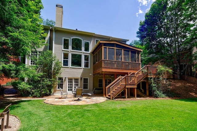 4310 Granby Way, Marietta, GA 30062 - back of house with a sunroom, a patio area, stairway, a chimney, and a lawn