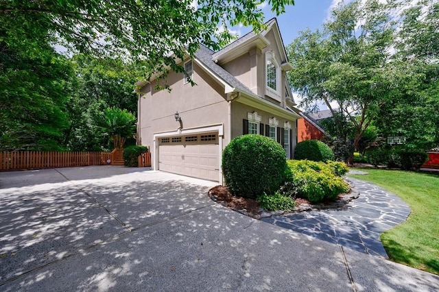 4310 Granby Way, Marietta, GA 30062 - view of side of home featuring stucco siding and driveway