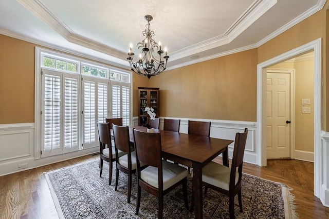 4310 Granby Way, Marietta, GA 30062 - dining area with a chandelier, wood finished floors, crown molding, a raised ceiling, and wainscoting