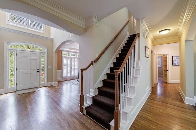 4310 Granby Way, Marietta, GA 30062 - entryway featuring arched walkways, wood finished floors, stairs, and ornamental molding