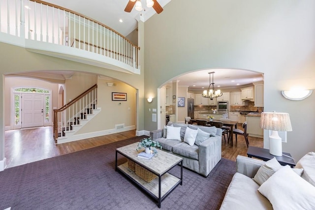 4310 Granby Way, Marietta, GA 30062 - living area with a towering ceiling, wood finished floors, ceiling fan, stairs, and recessed lighting