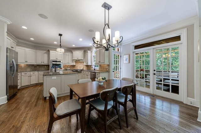 4310 Granby Way, Marietta, GA 30062 - dining area featuring crown molding, a chandelier, dark wood finished floors, french doors, and recessed lighting