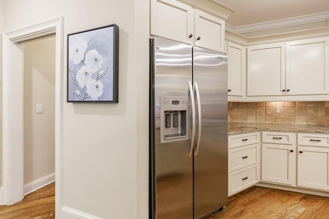 4310 Granby Way, Marietta, GA 30062 - kitchen featuring stainless steel fridge, light wood-style floors, crown molding, light stone countertops, and tasteful backsplash