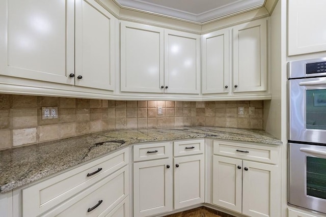 4310 Granby Way, Marietta, GA 30062 - kitchen featuring stainless steel double oven, tasteful backsplash, and light stone countertops