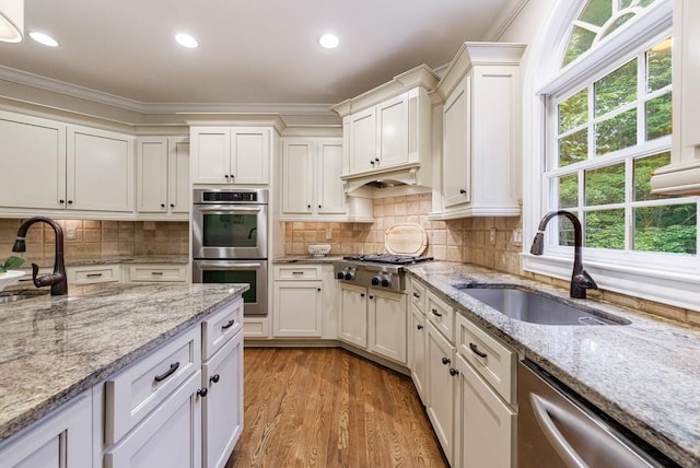 4310 Granby Way, Marietta, GA 30062 - kitchen with appliances with stainless steel finishes, ornamental molding, white cabinets, light wood finished floors, and recessed lighting