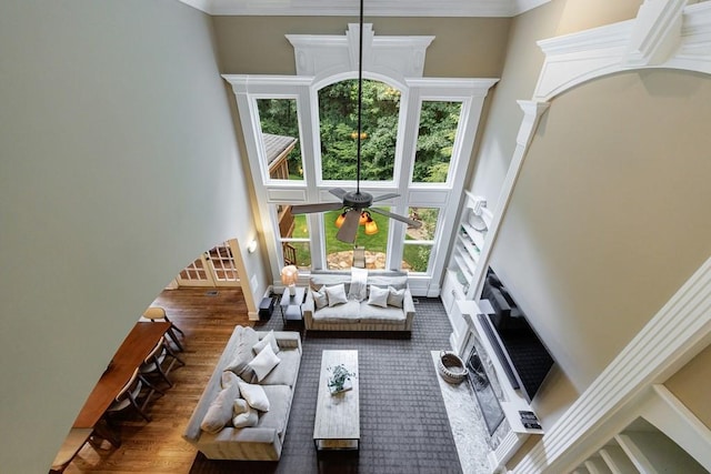 4310 Granby Way, Marietta, GA 30062 - living area featuring wood finished floors, a towering ceiling, a ceiling fan, and ornamental molding