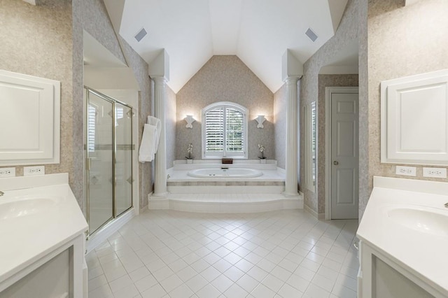 4310 Granby Way, Marietta, GA 30062 - bathroom with two vanities, decorative columns, tile patterned floors, wallpapered walls, and vaulted ceiling