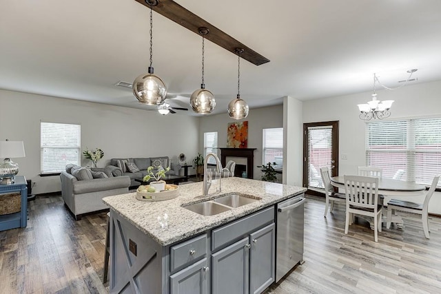 893 Whitfield Oak Rd, Auburn, GA 30011 - kitchen featuring stainless steel dishwasher, a sink, gray cabinetry, light wood-type flooring, and a chandelier