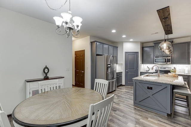 893 Whitfield Oak Rd, Auburn, GA 30011 - dining area with a chandelier, recessed lighting, and light wood-style flooring