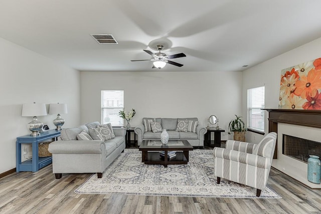 893 Whitfield Oak Rd, Auburn, GA 30011 - living area with healthy amount of natural light, wood finished floors, and a ceiling fan
